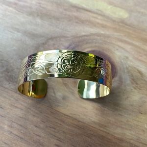 Carved First Nations Bracelet, sun and salmon design, gold-plated